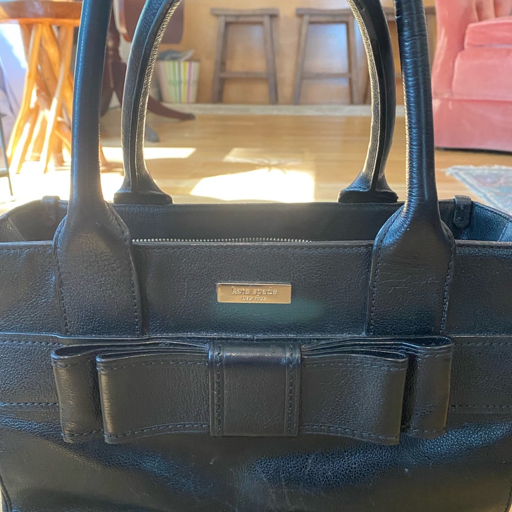 Black Kate Spade bag with polka dot interior